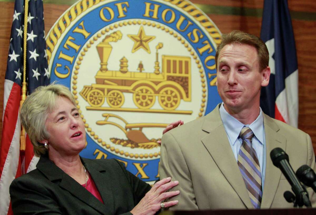 Mayor Annise Parker grabs firefighters union president Bryan Sky-Eagle's arm in a sign of camaraderie during a press conference at Houston City Hall, 901 Bagby, Tuesday, June 10, 2014 to announce a proposed 30-month labor contract. Sky-Eagle had said the deal is not perfect, that the two sides were not "holding hands," prompting Parker to clarify that they both support the measure, which the mayor said is "a compromise that moves us forward." ( Melissa Phillip / Houston Chronicle )