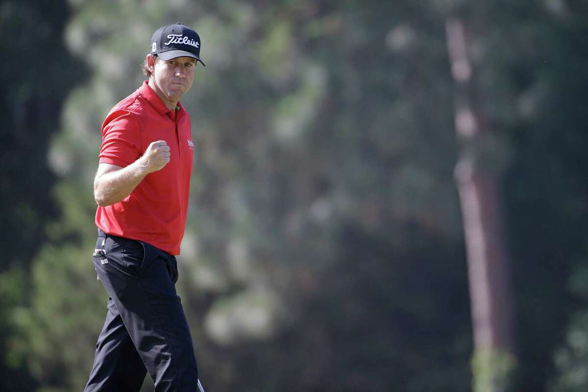 Erik Compton reacts to his birdie on the eighth hole during the final round of the U.S. Open golf tournament in Pinehurst, N.C., Sunday, June 15, 2014. (AP Photo/David Goldman)