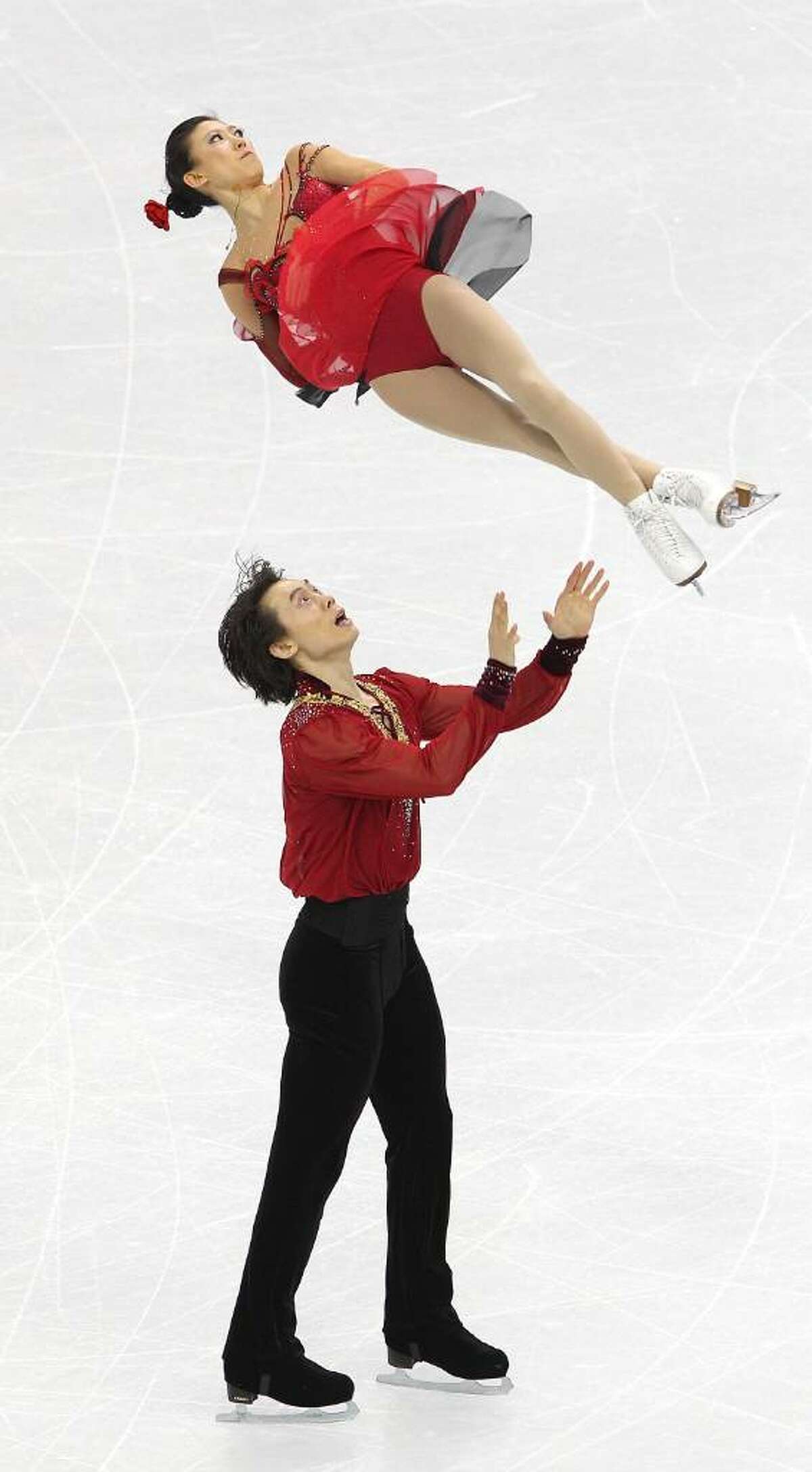 VANCOUVER, BC - FEBRUARY 15: Qing Pang and Jian Tong of China compete in the Figure Skating Pairs Free Program on day 4 of the Vancouver 2010 Winter Olympics at the Pacific Coliseum on February 15, 2010 in Vancouver, Canada. (Photo by Cameron Spencer/Getty Images) *** Local Caption *** Qing Pang;Jian Tong