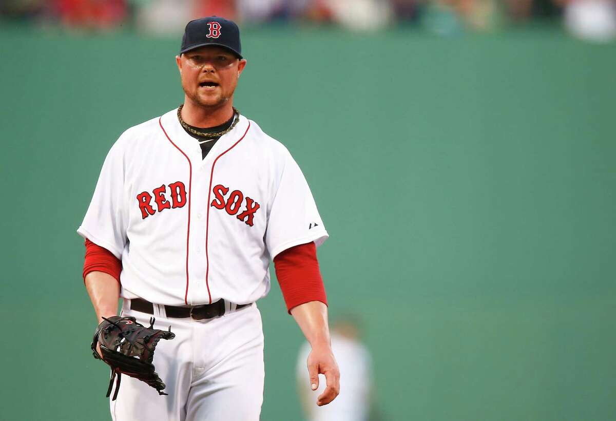 BOSTON, MA - JUNE 17: Jon Lester #31 of the Boston Red Sox yells in between pitches in the first inning against the Minnesota Twins in the first inning during the game at Fenway Park on June 17, 2014 in Boston, Massachusetts. (Photo by Jared Wickerham/Getty Images) ORG XMIT: 477585139