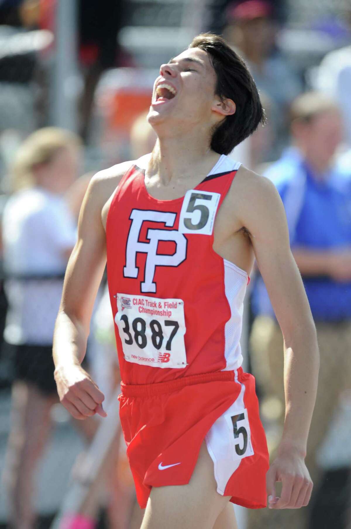 Fairfield Prep's Christian Alvarado celebrates after winning the boys 3200 meter run at the CIAC Class LL Connecticut Outdoor Track & Field State Championship at Danbury High School in Danbury, Conn. Thursday, June 5, 2014. Alvarado won the event with a time of 9:06.67. Staples won the girls overall championship and Ridgefield won the boys overall championship.