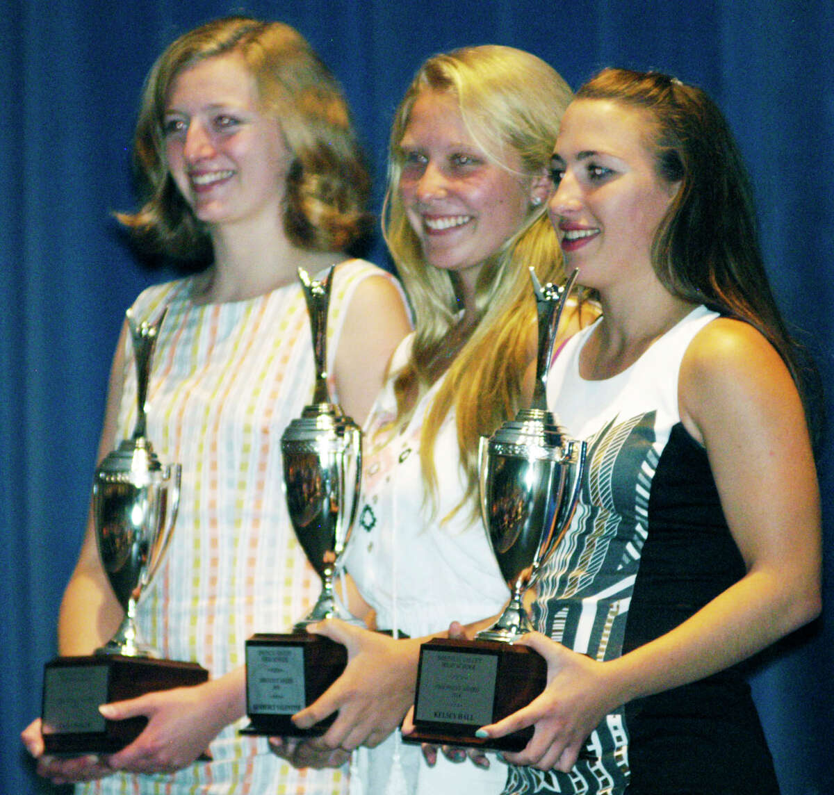 The school's 1,000-point athletes this year, from right to left, Kelsey Hall, Kim Valentine and Clara Wolfe, enjoy the spotlight during Shepaug Valley High School's annual athletic awards ceremony, June 6, 2014 at the school in Washington.