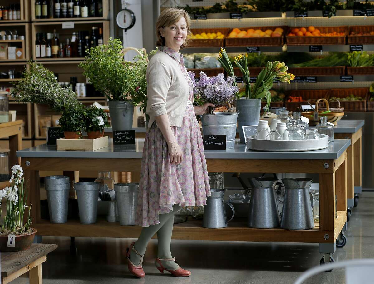 Cindy Daniel stands near a floral display in her store SHED Wednesday March 26, 2014 in Healdsburg, Calif. Cindy Daniel is the owner of the popular store SHED near the town square in Healdsburg, Calif.