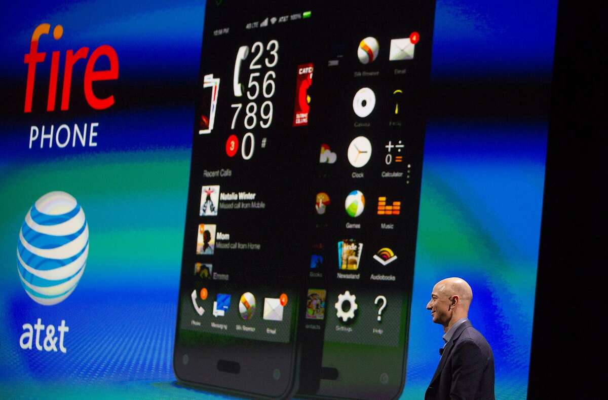 Jeff Bezos, chief executive officer of Amazon.com Inc., speaks after unveiling the Fire Phone during an event at Fremont Studios in Seattle, Washington, U.S., on Wednesday, June 18, 2018. Amazon.com Inc. jumped into the crowded smartphone market with its own handset called Fire Phone, ramping up competition with Apple Inc. and Samsung Electronics Co. Photographer: Mike Kane/Bloomberg *** Local Caption *** Jeff Bezos