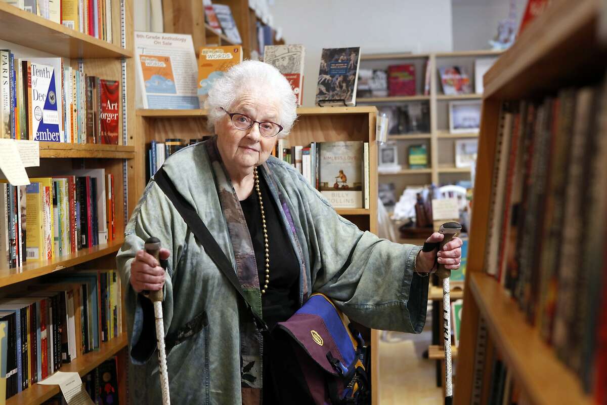 June Fisher, an 81 year old "senior advisor", poses for a portrait at Folio Books, where she says she spends most of her money, in her neighborhood in San Francisco, CA, Tuesday June 17, 2014.