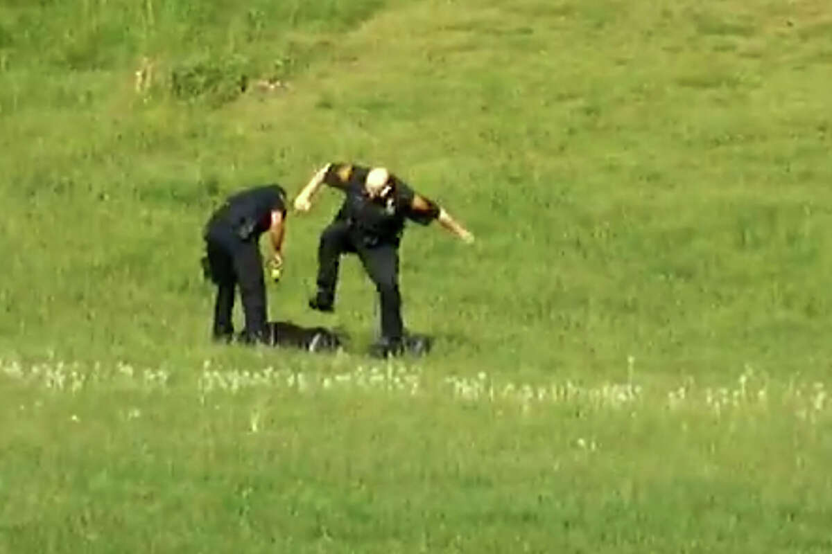 A screen grab from a video, posted on YouTube on Jan. 6, 2013, showing three Bridgeport, Conn. police officers kicking a man in Beardsley Park on May 20, 2011. Officers Elson Morales, Joseph Lawlor and Clive Higgins were put on the paid administrative leave Jan.18, 2013 pending an investigation of the incident by the city's Office of Internal Affairs. The man, who has not been identified, is lying on the ground after being Tasered by one of the officers when two of the officers begin kicking him. A third officer then gets out of his patrol car and walks over to where the other two are still kicking the man and then he too begins kicking him.