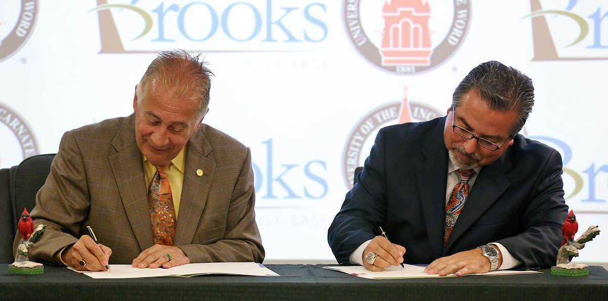 UIW President Lou Agnese (left) and Brooks City Base President and CEO Leo Gomez sign an accord on housing the osteopathic medical school.