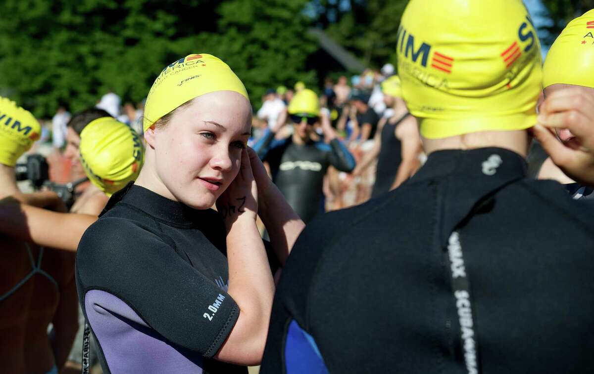 Georgia Leigh puts on her cap during the eighth-annual Greenwich-Stamford Swim Across America event on Saturday, June 21, 2014.