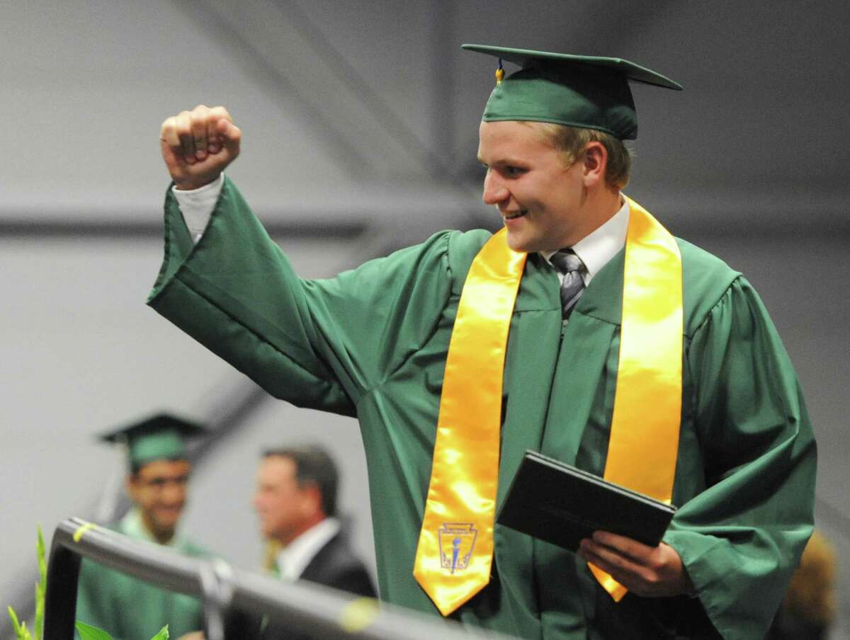Bryan Ross fist pumps after receiving his diploma at the New Milford High School 2014 Graduation Ceremony at Western Connecticut State University's O'Neill Center in Danbury, Conn. Saturday, June 21, 2014.