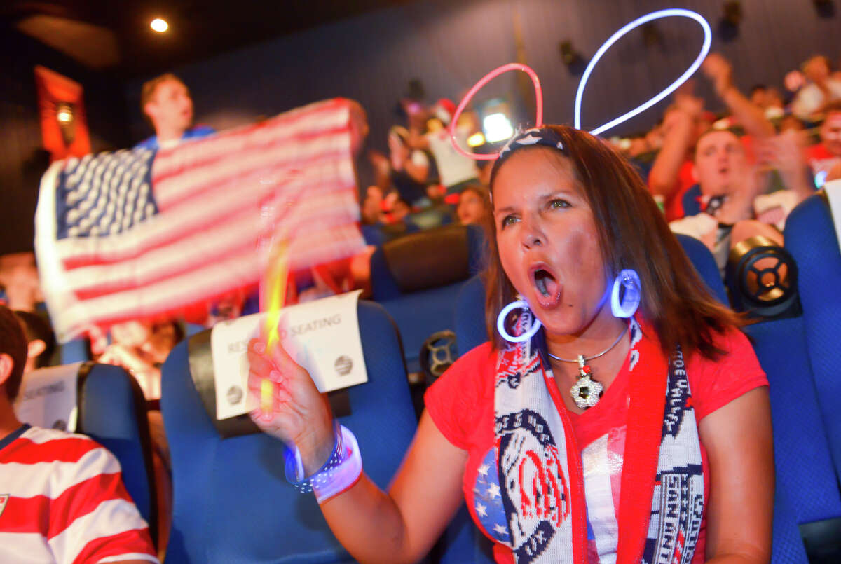 Cynthia Calzada cheers the American team Sunday during a viewing party at Santikos Palladium IMAX Theater to watch the USA versus Portugal World Cup soccer match.