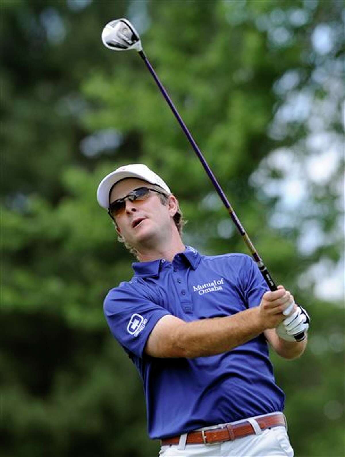Kevin Streelman watches his drive on the second hole during the final round of theTravelers Championship golf tournament in Cromwell, Conn., Sunday, June 22, 2014. Streelman finished his round with seven straight birdies to win the tournament at 15-under par. (AP Photo/Fred Beckham)