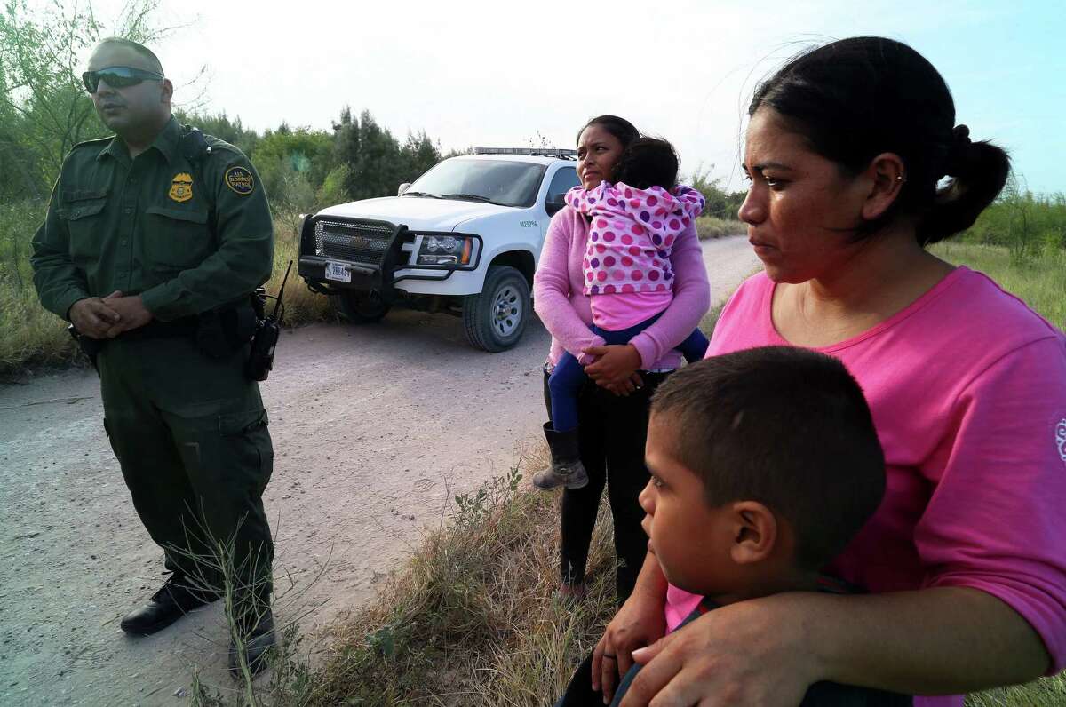 Border Patrol agents process migrants from Honduras and Guatemala, many of them women and children. 