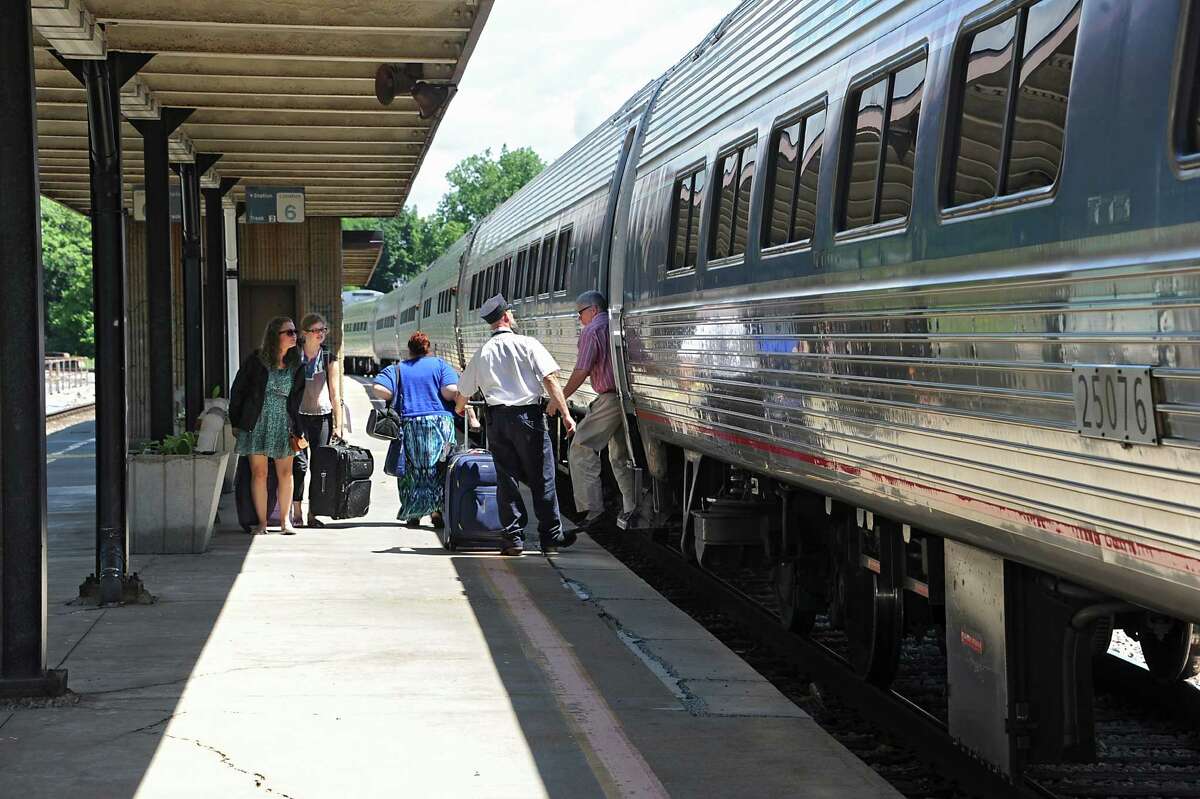 Passengers exit and board an Amtrak train from Albany at the Schenectady Train Station Thursday, June 19, 2014 in Schenectady, N.Y. This train was headed north towards Montreal. (Lori Van Buren / Times Union)