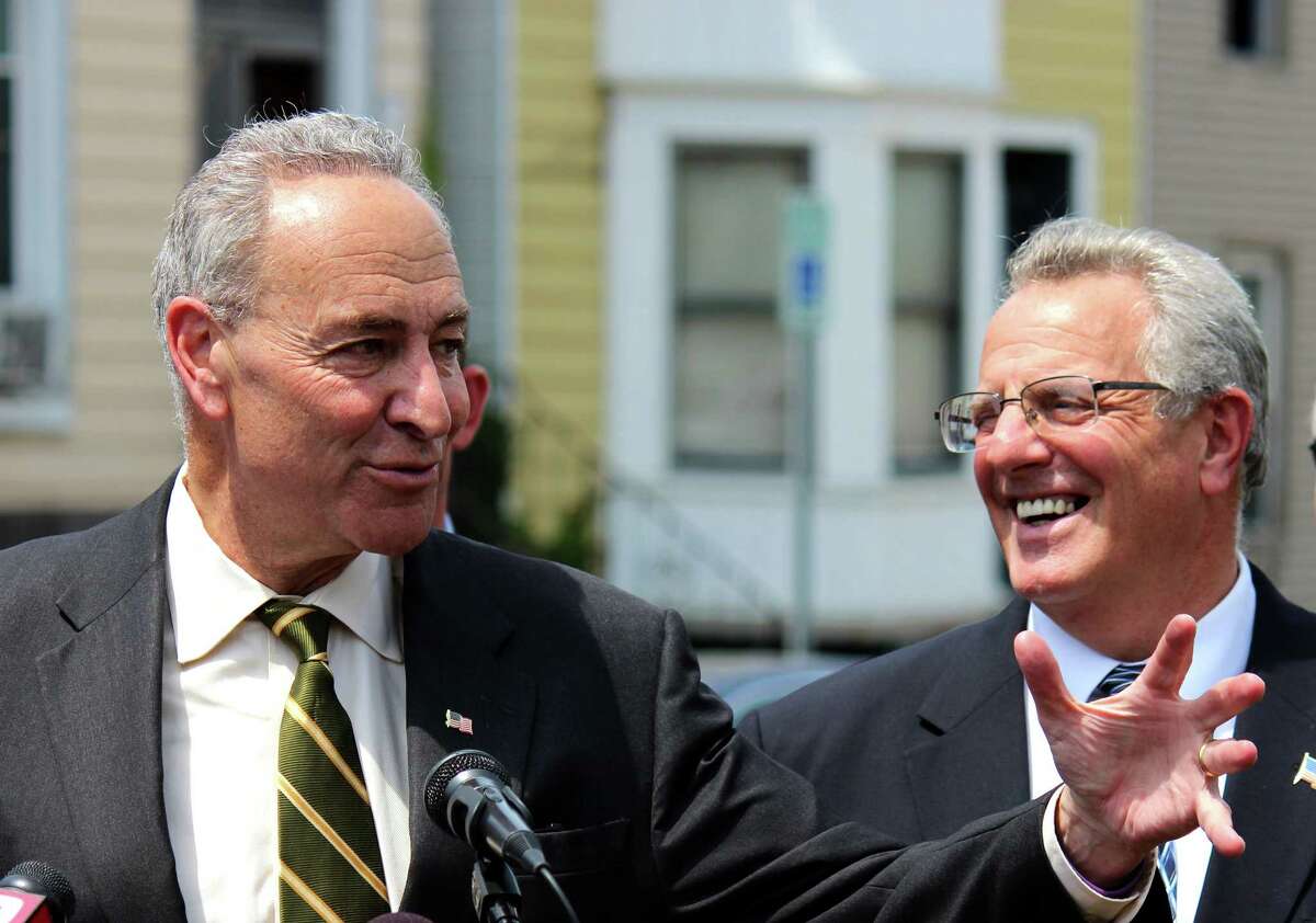 U.S. Senator Charles E. Schumer, left, and Troy Mayor Lou Rosamilia, right, announced a campaign to fight for Community Development Block Grant Program funding (CDBG) during a news conference Monday, June 23, 2014, in Troy N.Y. In order to eligible for CDBG funding a metropolitan city must have a population of at least 50,000. In 2012, Troy had a population of 50,072, but that number recently slipped to 49,946 ? just 54 residents short. (Selby Smith / Special to the Times Union)