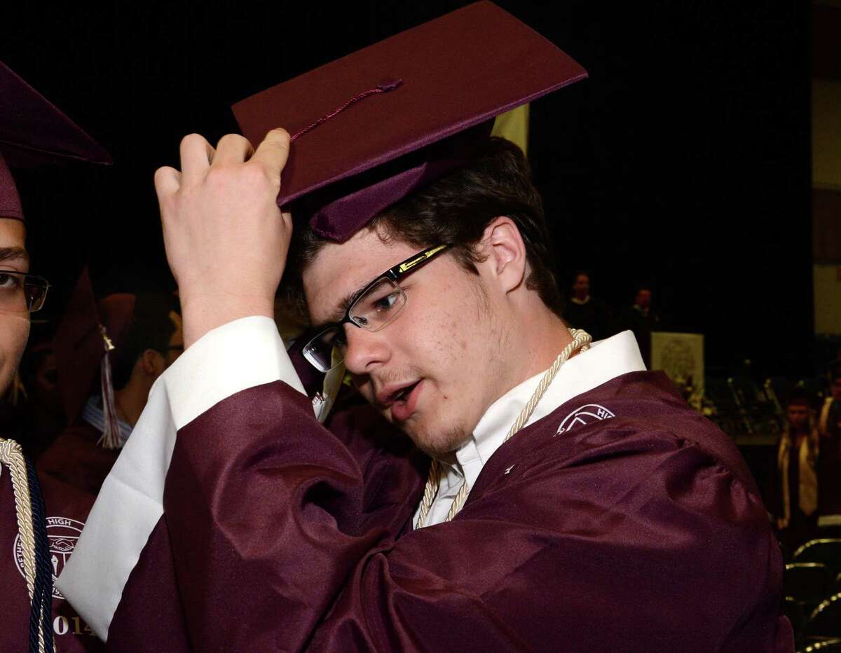 Daniel Tucciarone put on his cap in preperation for the Bethel High Schools Commencement Ceremony that took place at Western Connecticut State University in the O'Neill Center on Monday June 23, 2014.