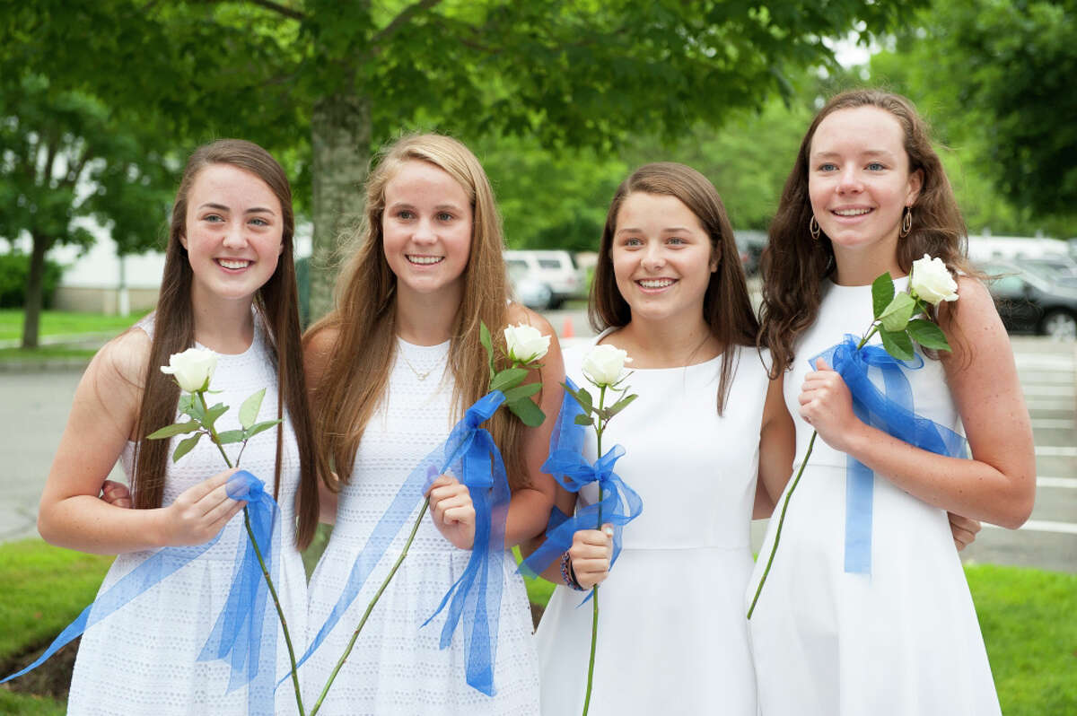 New Canaan Country School ninth-graders Stella Noels, Phoebe Slaughter, Lily von Stade and Maddie Smith, from left to right, are all smiles on their recent graduation day.