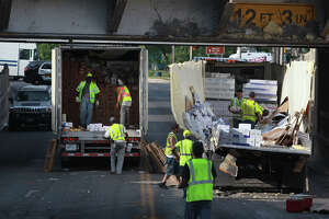 Flour truck gets wedged under railroad bridge