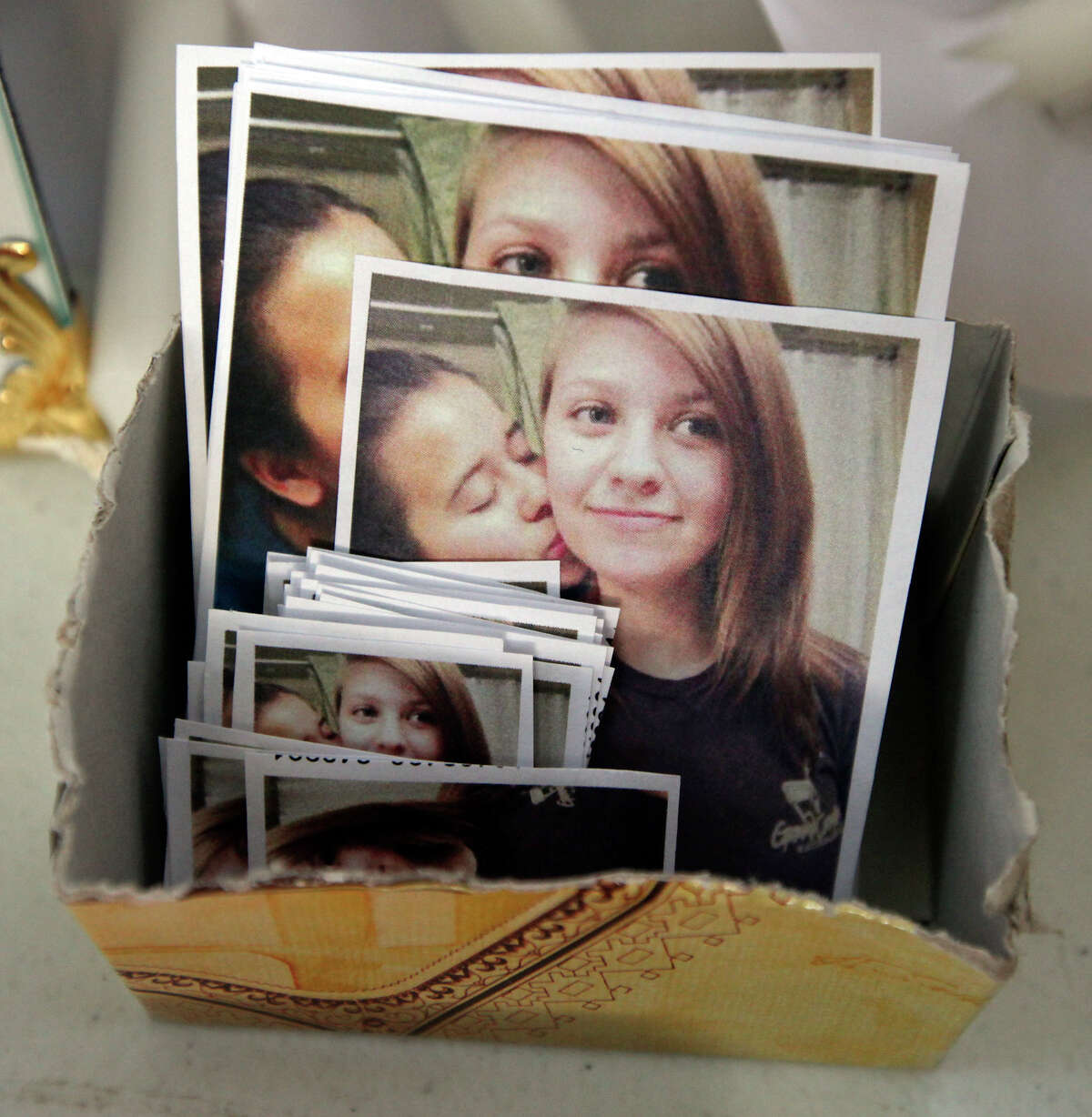 Photos of Mary Kristene Chapa (left) and her girlfriend Mollie Judith Olgin that were given to people attending a candle light vigil for the girls Friday June 29, 2012 at Woodlawn Lake. Olgin, 19, and Chapa, 18, were found shot in the head Friday, June 22, 2012, in a Portland, Texas park. Olgin died at the scene and Chapa later recovered.