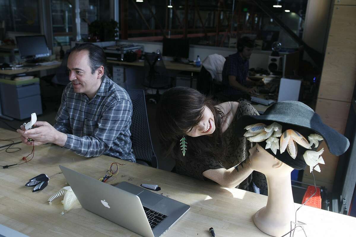 Artists in residence Paolo Salvagione, left, and Mikaela Holmes work on their pieces at Autodesk in San Francisco, Calif. on Wednesday, June 11, 2014. Autodesk features machinery and 3d printers for the artists to use.
