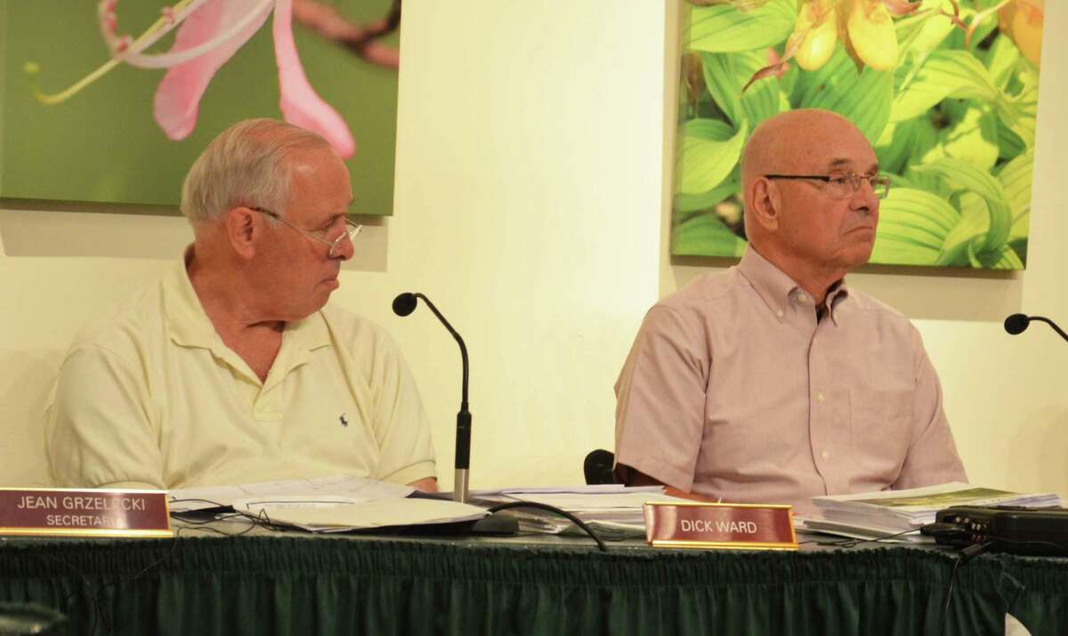 Planning and Zoning Commission Chairman Laszlo Papp, right, and member Dick Ward at a meeting Tuesday, June 24, 2014, at the New Canaan Nature Center, in New Canaan, Conn. The commission unanimously voted Tuesday to adopt the 2014 Plan of Conservation and Development.