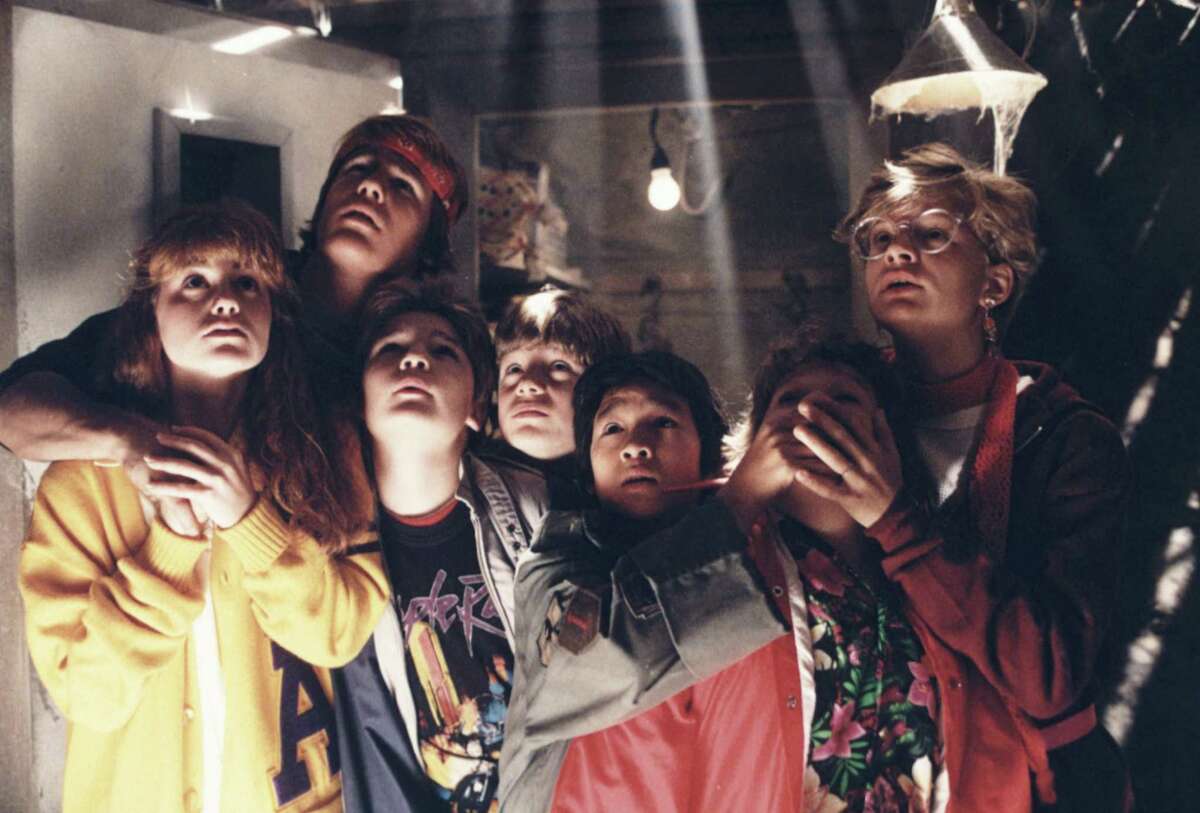 Kerri Green, from left, Josh Brolin, Corey Feldman, Sean Aastin, Ke Huy-Quan, Jeff B. Cohen and Martha Plimpton star in "The Goonies."
