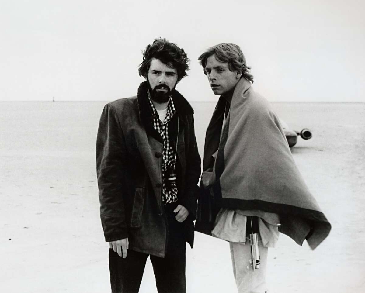 "Star Wars" director George Lucas and actor Mark Hamill, who portrayed Luke Skywalker, on the salt flats of Tunisia during principal photography of "Episode IV." 