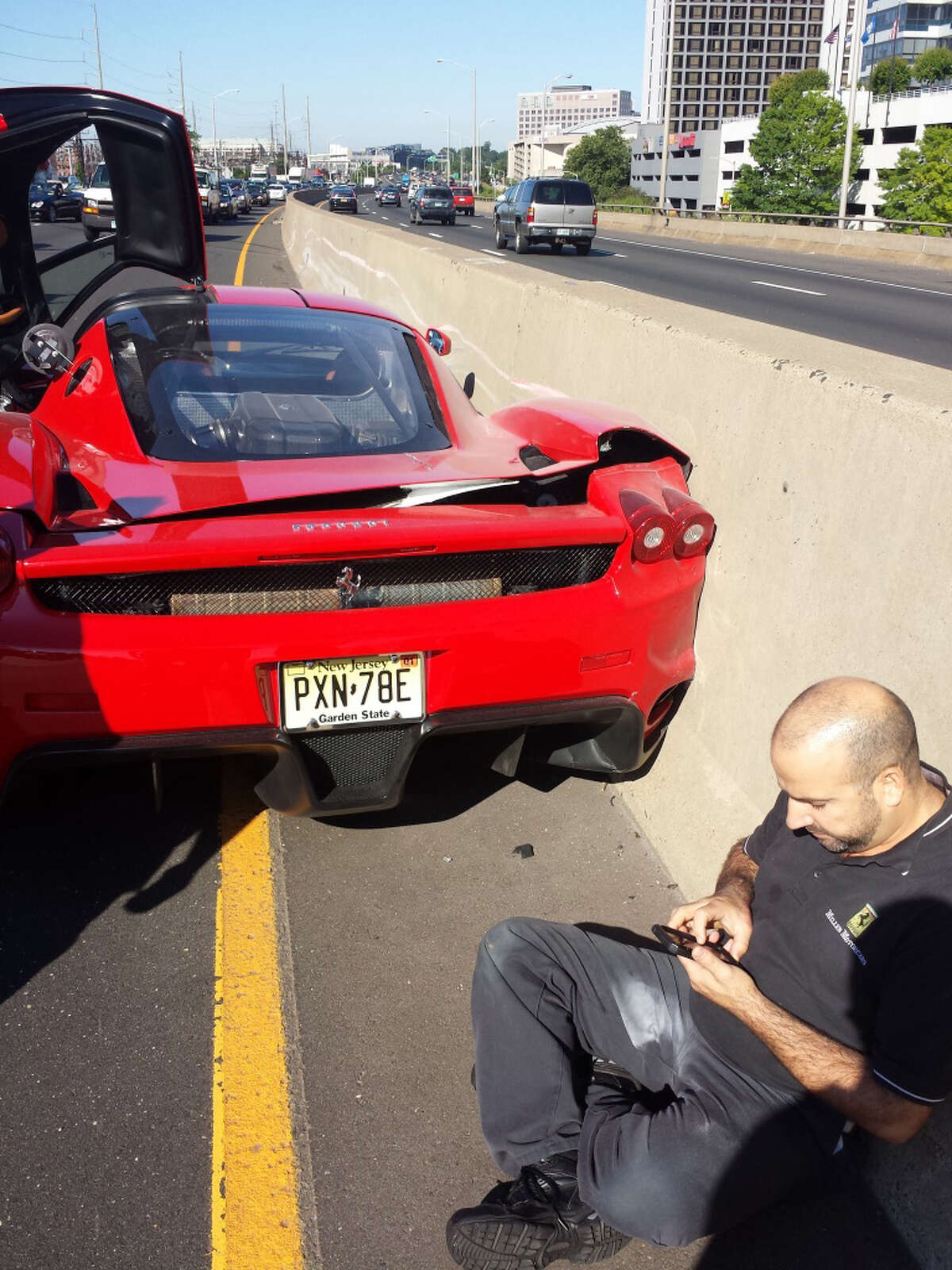 A New York man driving a rare Ferrari Enzo owned by a Cuban-born multi-millionaire lost control of the $600,000-plus car while getting onto Interstate-95 at Exit 7 in Stamford Monday, June 23, 2014.