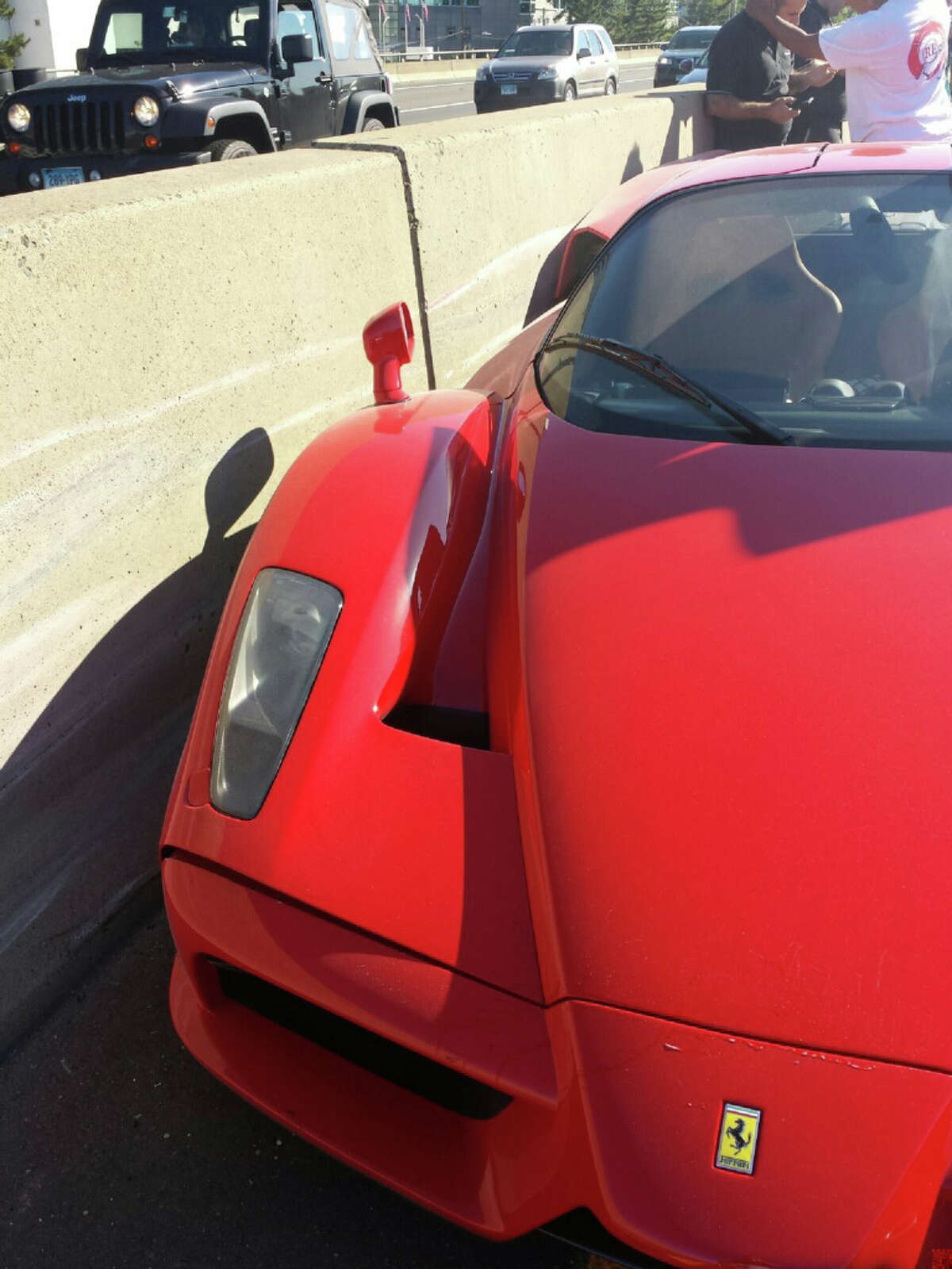 A New York man driving a rare Ferrari Enzo owned by a Cuban-born multi-millionaire lost control of the $600,000-plus car while getting onto Interstate-95 at Exit 7 in Stamford Monday, June 23, 2014.