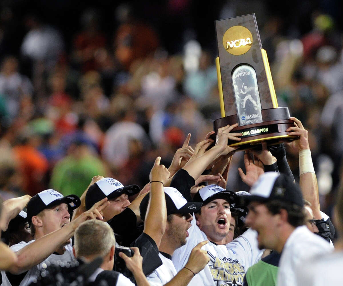 Vanderbilt players celebrate after Vanderbilt defeated Virginia 3-2 in Game 3 of the best-of-three NCAA baseball College World Series finals in Omaha, Neb., Wednesday, June 25, 2014. (AP Photo/Eric Francis)