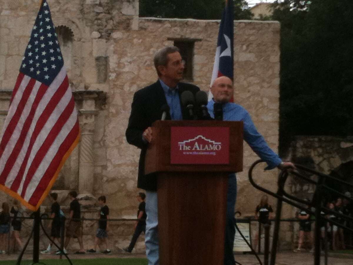 The presentation begins as Phil Collins prepares to present his artifacts collection to the Alamo.
