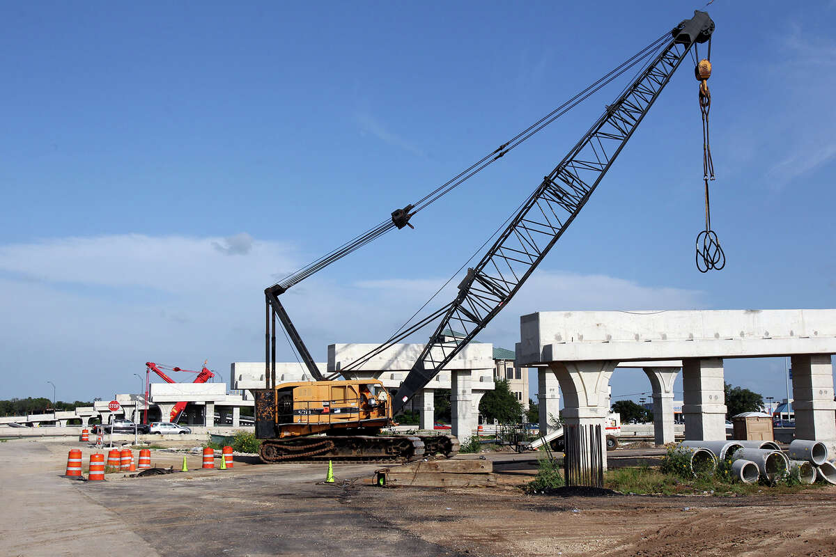 Equipment is in place on Friday afternoon for the placement of expansive beams to span the 281 north roadway near the airport as the Wurzbach Parkway construction continues on Thursday, June 27, 2014.