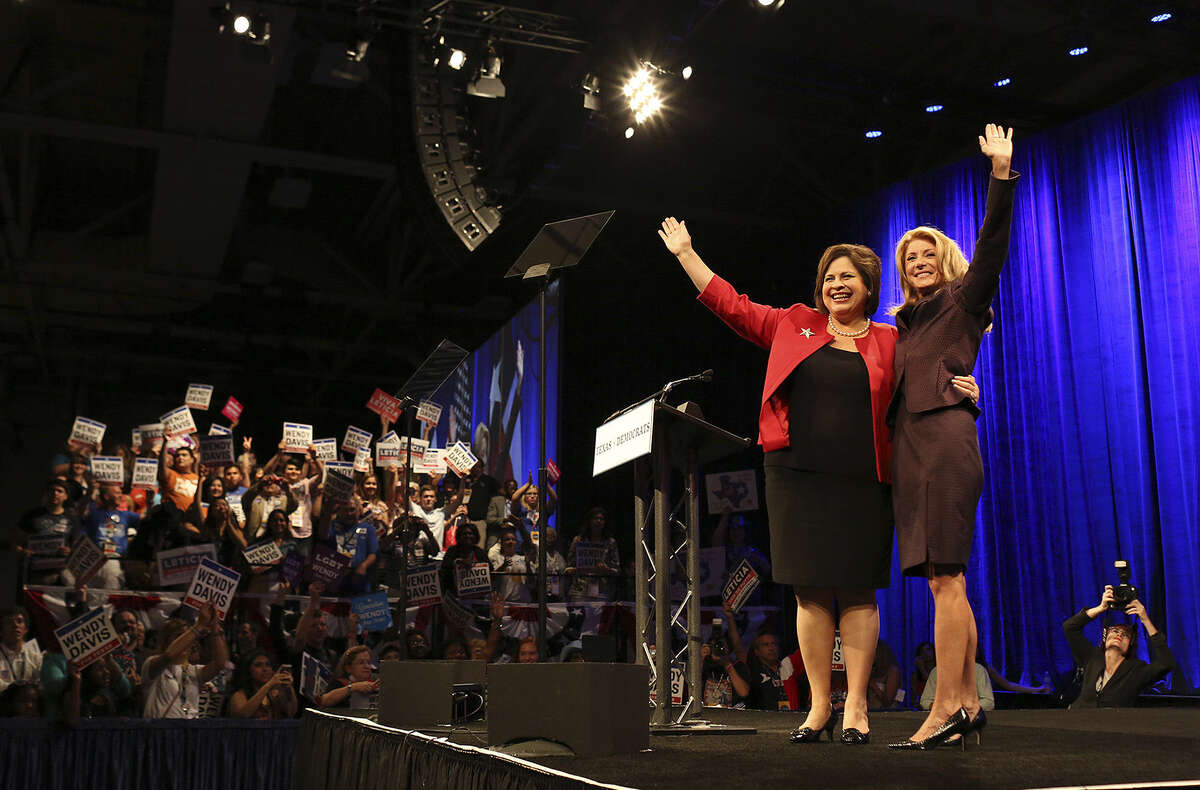 Lieutenant governor hopeful Leticia Van de Putte of San Antonio joins Wendy Davis of Fort Worth on stage after the governor candidate's address to the Democratic convention.