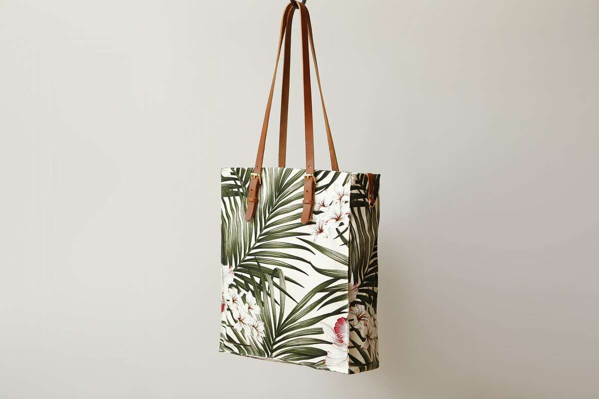 Handcrafted in San Francisco and made from soft and slightly textured 100 percent cotton Hawaiian barkcloth, the Presidio Palms Tote Tote ($175, www.futureglory.co) measures 13"L x 15"W x 4"H and features leather straps with adjustable brass buckles and reinforced stitching for durability.