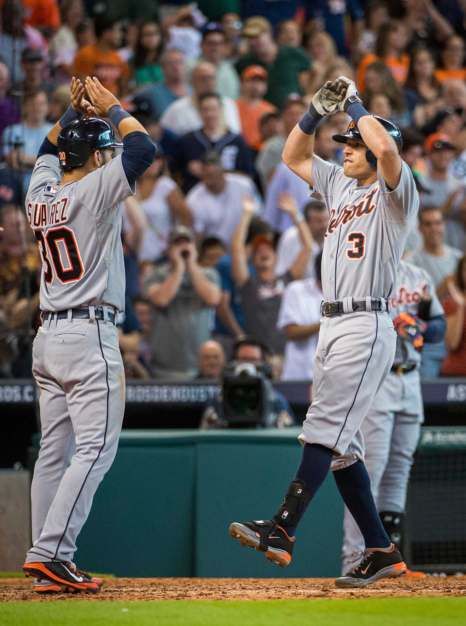 Houston Astros' L.J. Hoes, right, celebrates after his solo home