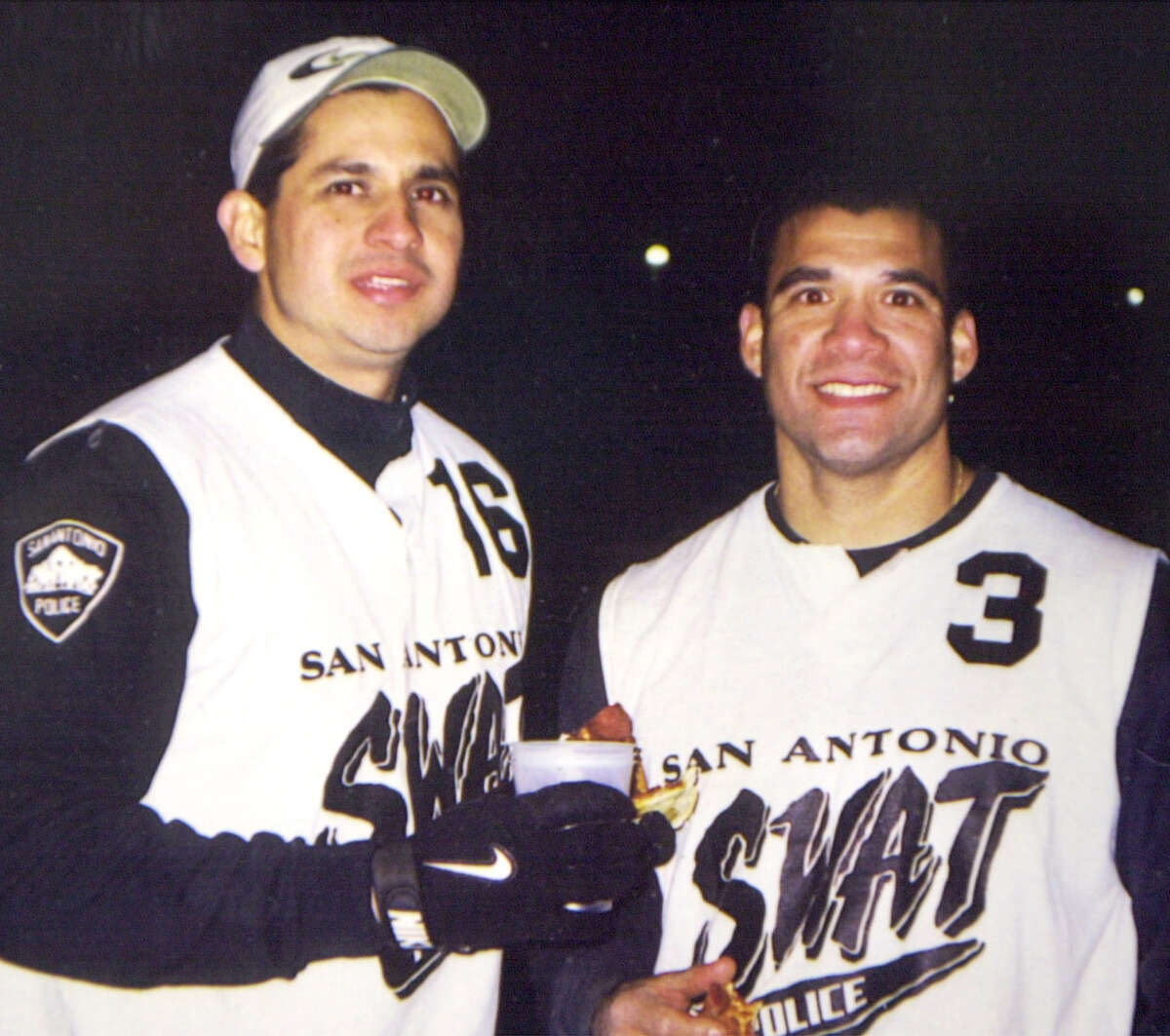 San Antonio Police Dept. SWAT team members John "Rocky" Riojas (right) is seen with his partner Joe Obregon in this undated photo. When Riojas was killed, he left behind a wife, Sandra, a daughter, Victoria, and a son, John Michael, according to Express-News reports.