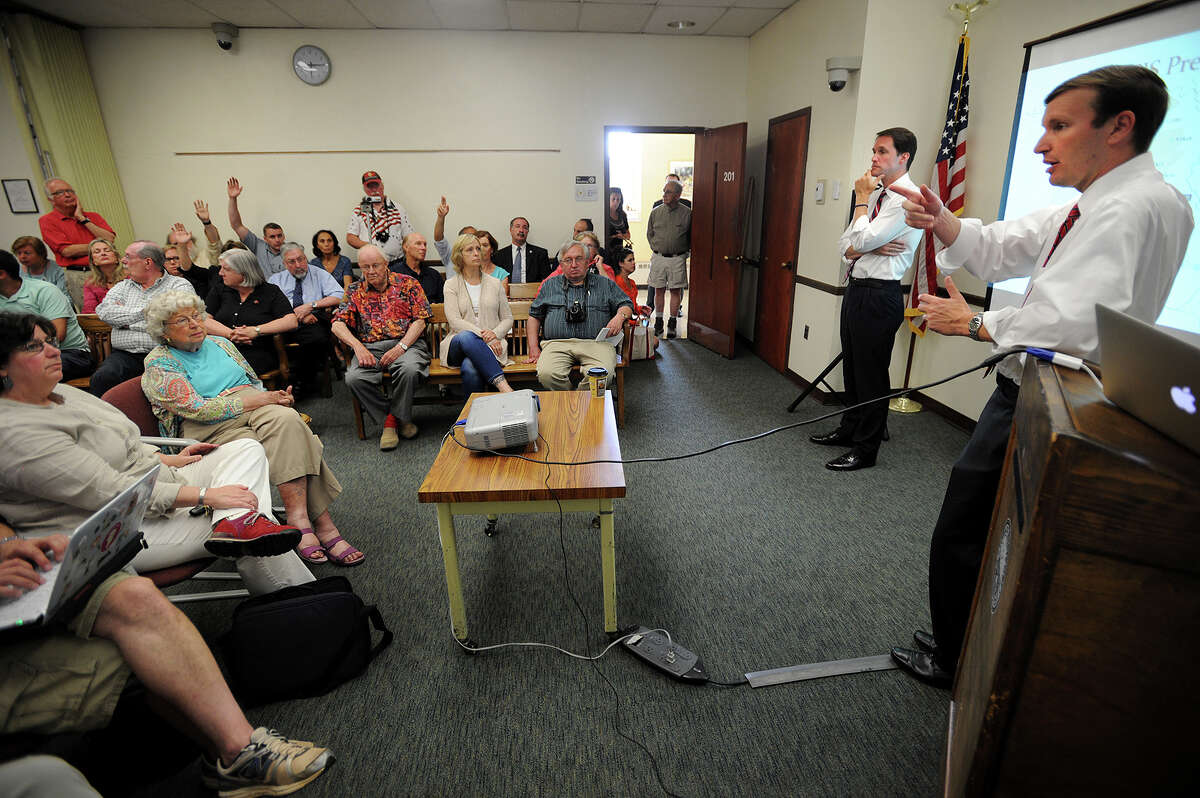Connecticut Senator Chris Murphy, right, and Representative Jim Himes field questions during a town hall meeting on the Iraq crisis and foreign policy at the Westport Town Hall in Westport, Conn. on Monday, June 30, 2014.
