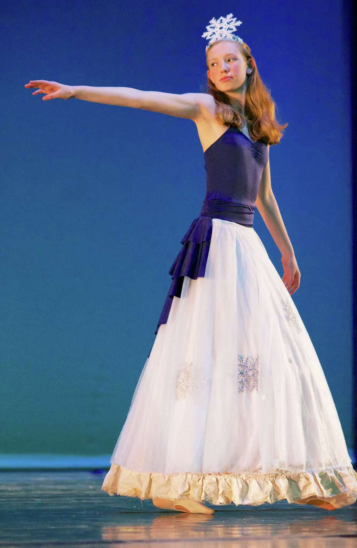 Abbi Debes, 13, of New Milford performs "The Minister of Winter" during final rehearsal for Studio D's gala dance festival at New Milford High School, May 31, 2014