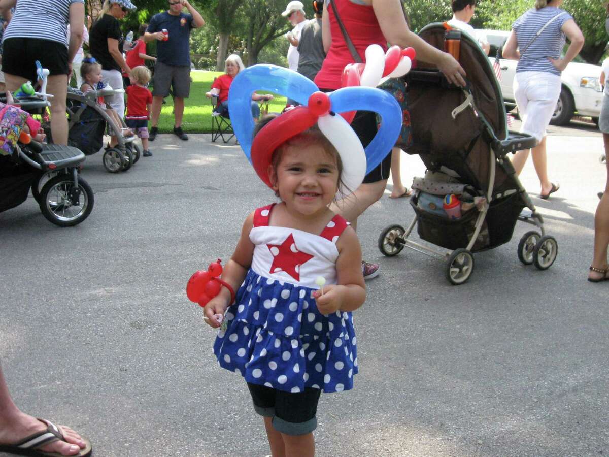 Abby Smith, 2, gets into the spirit of independence in the 2013 Terrell Hills Fourth of July parade.