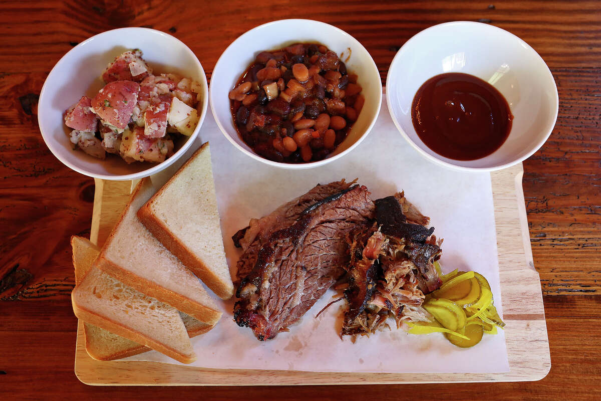 The Granary in San Antonio serves new style baked beans, potato salad, buttermilk bread, pickles and sauce.