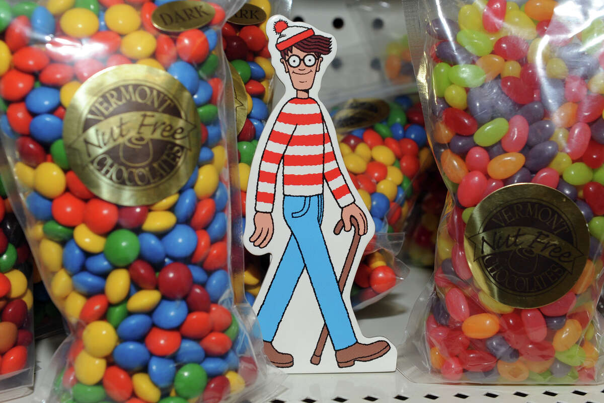 Waldo hides on a shelf of candy at English Apothecary, in Bethel, Conn. July 1, 2014. For the annual "Find Waldo in Bethel!" scavenger hunt participants search for miniature Waldo's hidden in 25 local shops and businesses around Bethel.