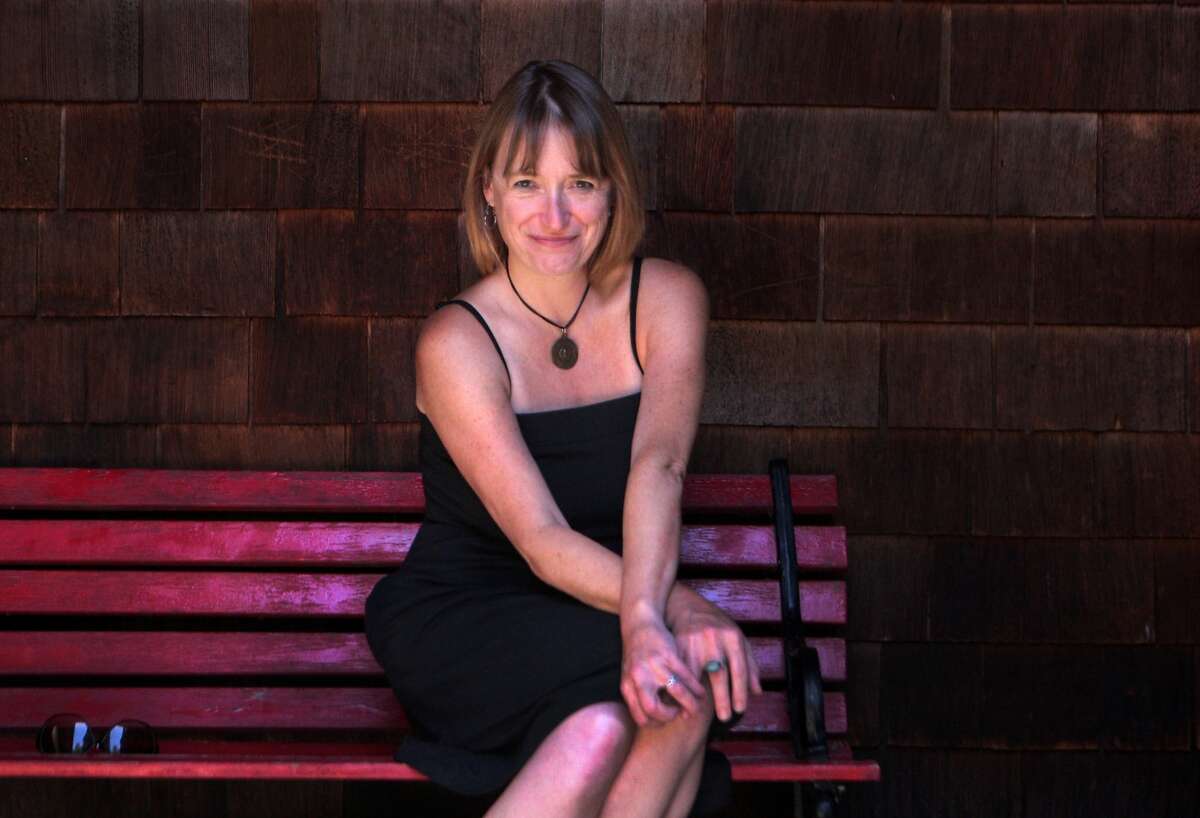 Writer Kristy Nielsen, whose poetry and short fiction inspired the new fantasy/horror film "A Measure of the Sin," sits outside her home in Stanford, Calif. on Monday, June 23, 2014. The film, which was screened at various festivals across the country, is now available on DVD and video on demand. Nielsen is legally blind.