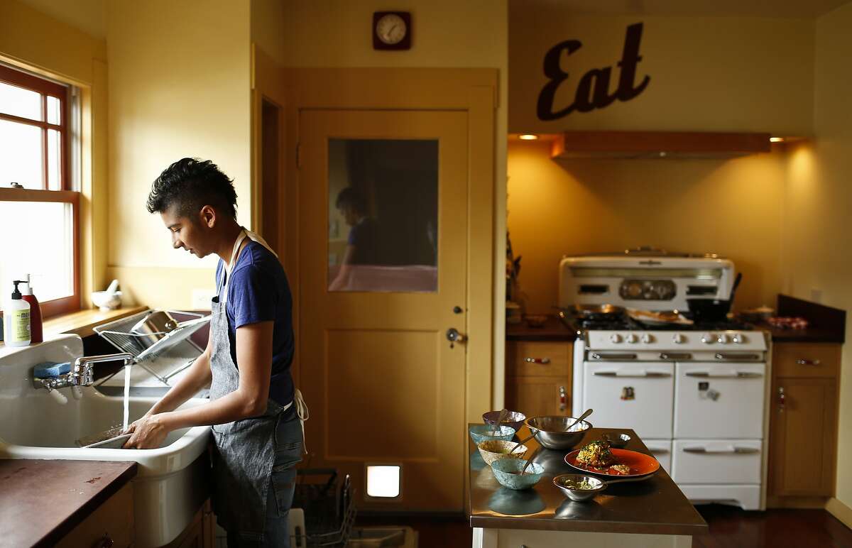 Preeti Mistry, owner of Oakland restaurant Juhu Beach Club, cleans up after cooking in her Oakland, Calif., home on Wednesday, June 25, 2014.