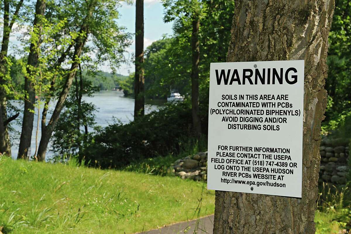 Signs are posted at the kayak launch at Hudson Crossing Park to warn boaters of potential exposure to polychlorinated biphenyls (PCB's) Friday, June 27, 2014 in Schuylerville, N.Y. The warning signs were results of soil samples taken last fall. (Lori Van Buren / Times Union)
