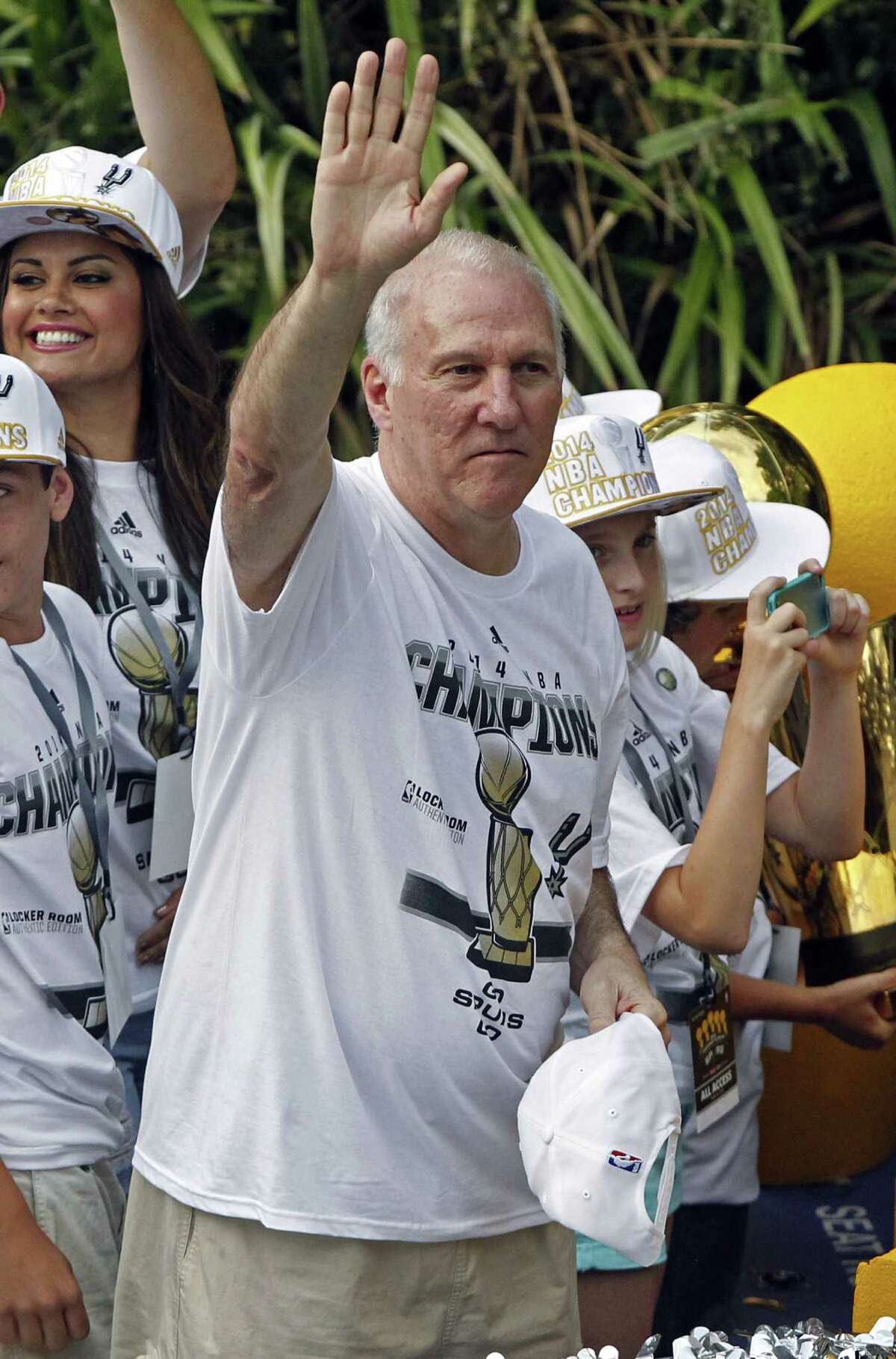 Spurs coach Gregg Popovich acknowledges well-wishers   during the River Walk parade in June. A reader defends the coach for using t  “horrific” to describe the loss to the Miami Heat in the 2013  NBA Finals.