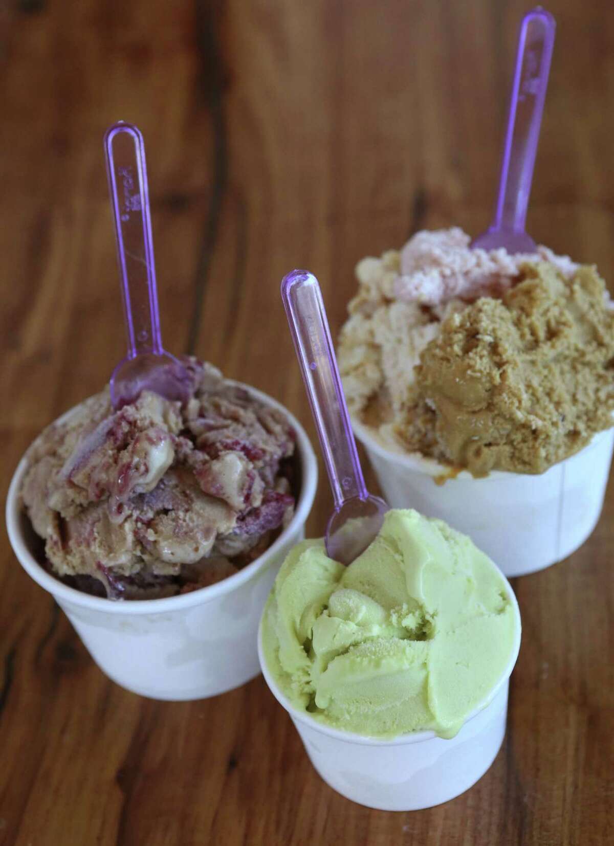 Amaretto with cherry (from left) and pistachio gelatos, plus a one-cup trio of salted caramel, strawberry and tiramisu.