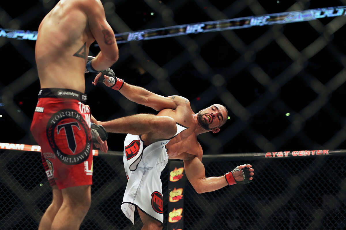 Marcelo Guimaraes kicks his opponent Andy Enz during UFC Fight Night at the AT&T Center on June 28, 2014.