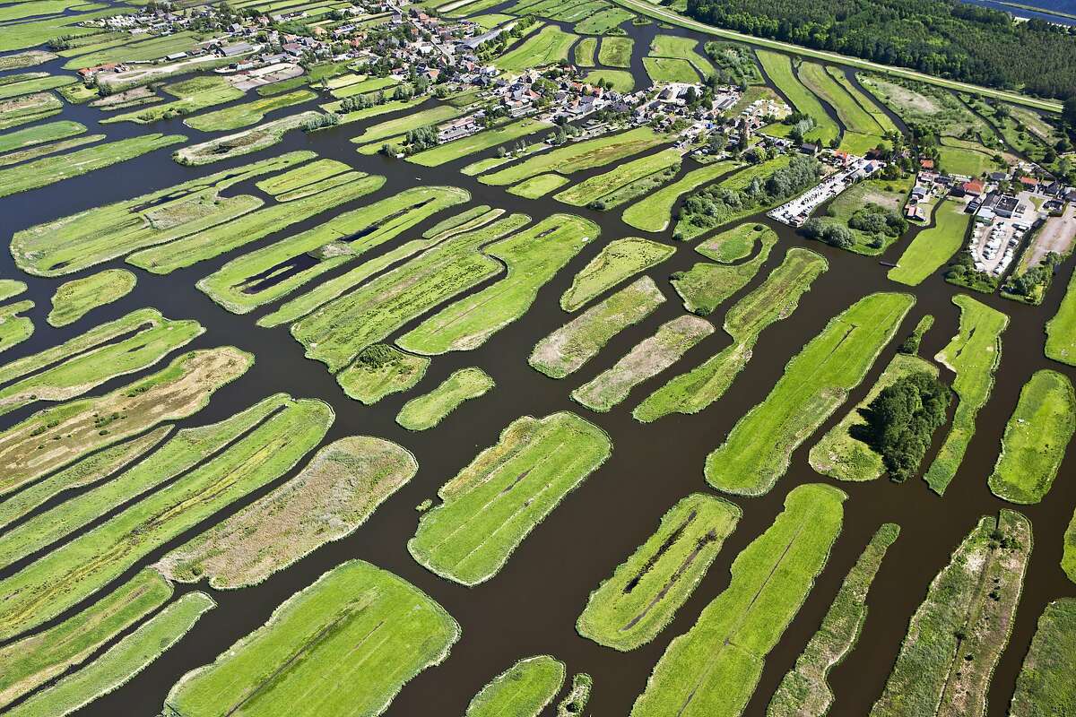 The Netherlands, Jisp, Aerial, Village and polder landscape. Netherlands, Jisp, Polder landscape