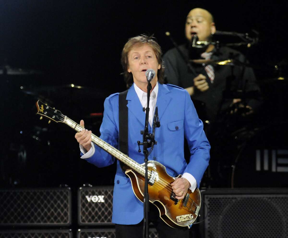 Sir Paul McCartney performs with his band during the “Out There" Tour at the Times Union Center on Saturday, July 5, 2014, in Albany, N.Y. (Photo by Hans Pennink/Invision/AP)