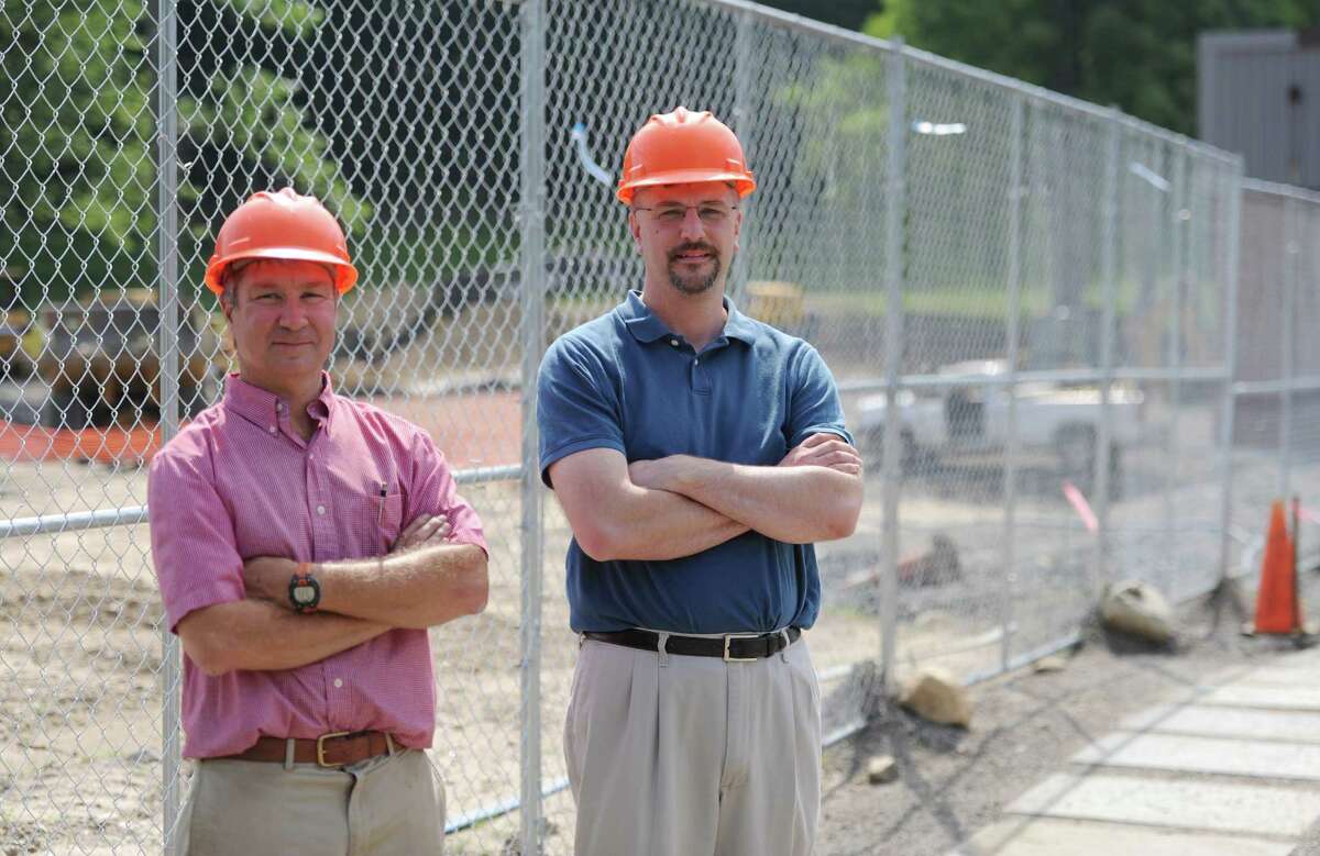 Berkshire Coporate Park Principal Greg Steiner, left, and Memry Vice President of Operations Tim Wilson pose outside the construction site of Memry in the Berkshire Corporate Park in Bethel, Conn. Monday, July 7, 2014. A new development is now proposed for Berkshire Corporate Park