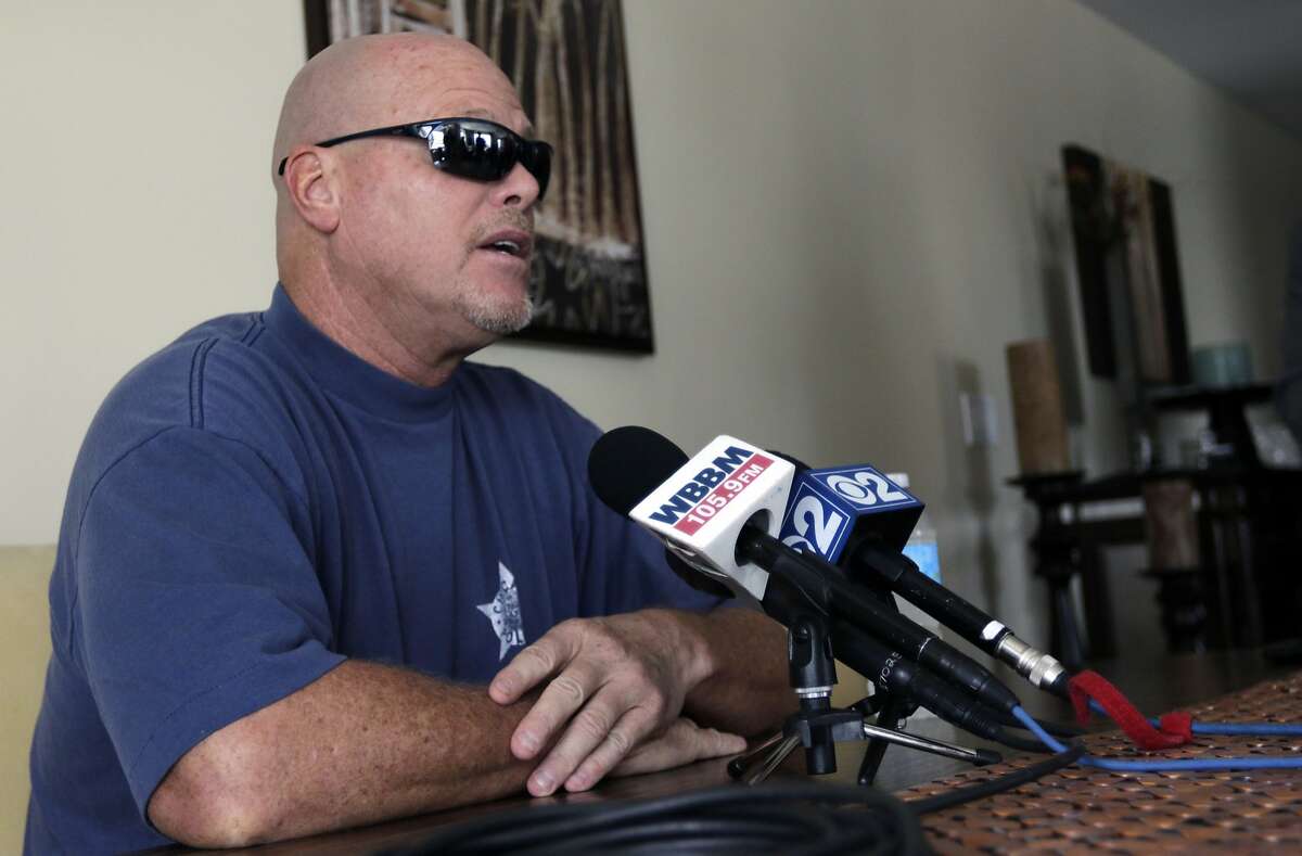 Former NFL football quarterback Jim McMahon speaks during a news conference Tuesday, June 17, 2014 in Chicago. McMahon spoke of his ongoing battle with dementia that he believe is related to his years of hits he took while playing in the league. McMahon is part of a federal lawsuit filed in San Francisco accusing teams of illegally dispensing powerful narcotics and other drugs to keep players on the field without regard for their long-term health. He led the Chicago Bears to victory in the 1985 Super Bowl. (AP Photo/Stacy Thacker)
